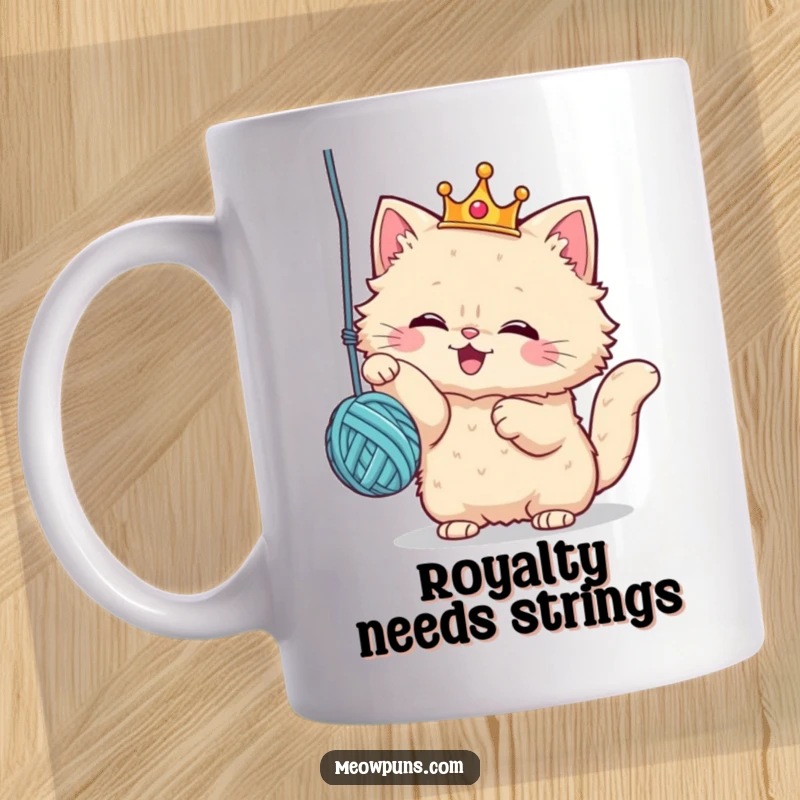 Funny cat mug with a fluffy cat wearing a crown, joyfully playing with a yarn ball, exuding royal silliness and playful energy.