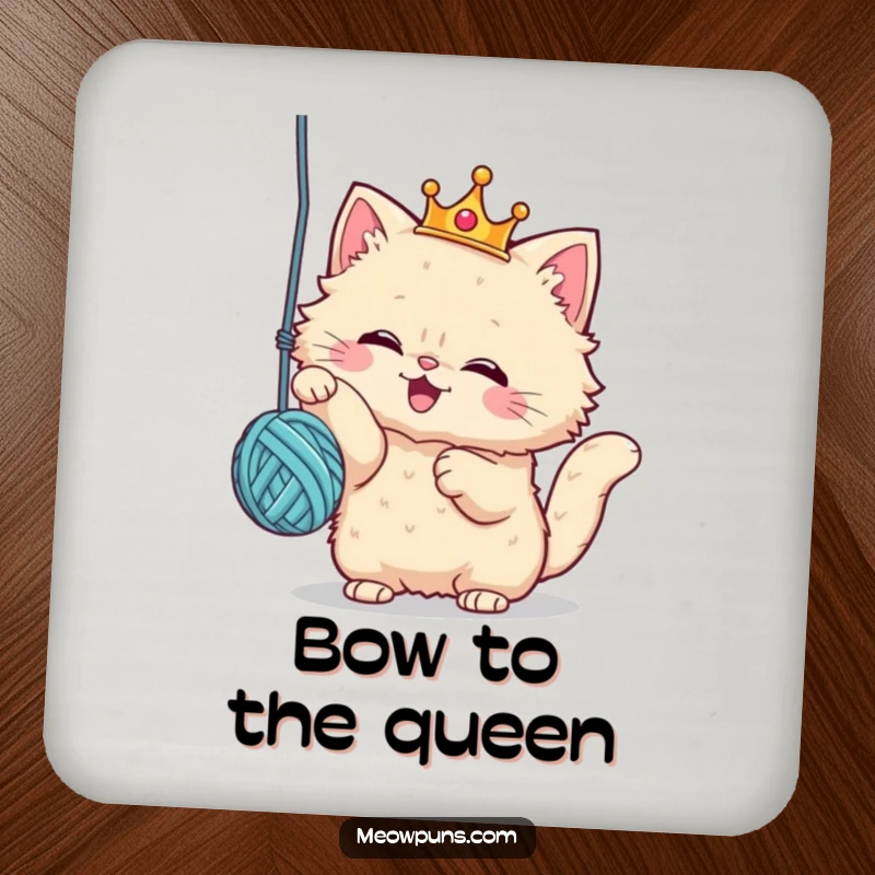 Funny drink coaster featuring a fluffy cat wearing a crown, batting at a yarn ball, providing surface protection with royal feline humor.