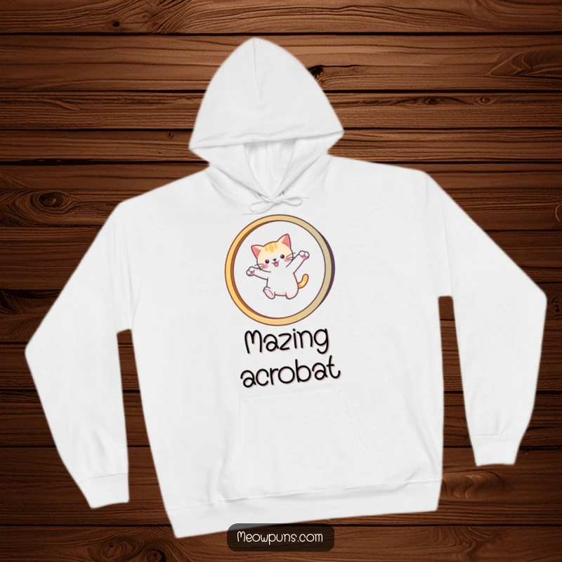 Funny hoodie with a cat leaping through a stylized 'M' hoop, combining warmth with humorous feline acrobatics.