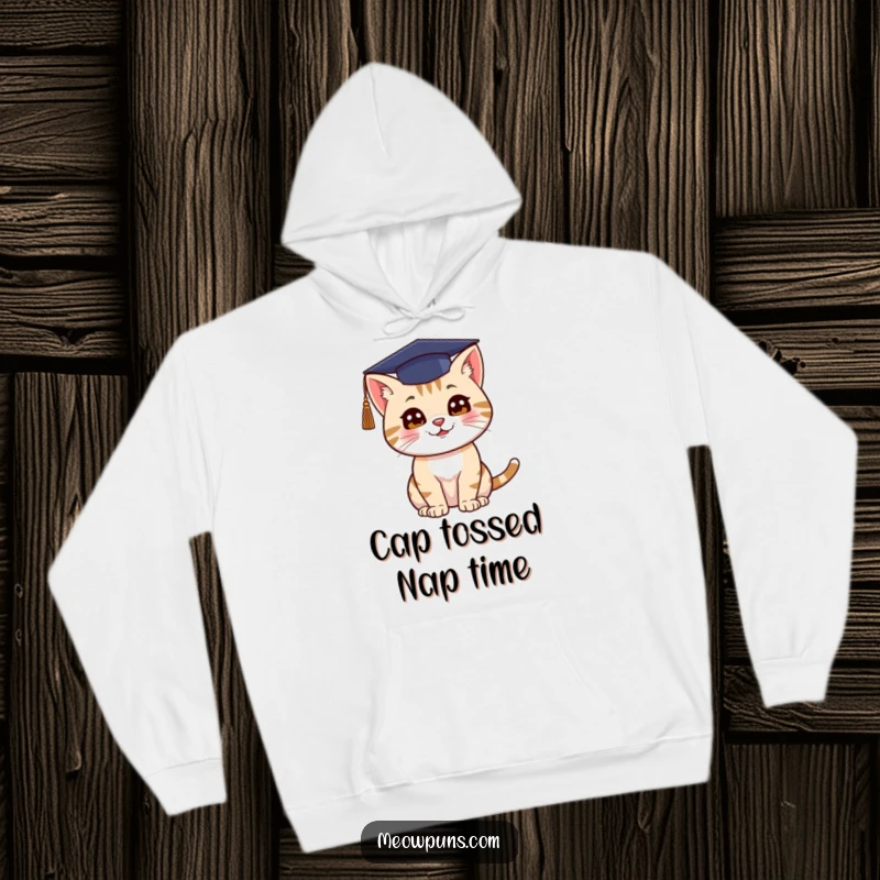 Funny hoodie depicting a cat wearing a graduation cap and enthusiastically tossing it into the air.