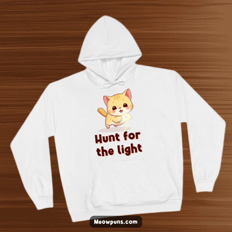 Funny hoodie featuring a focused cat chasing a glowing laser dot, embodying playful energy and warmth.