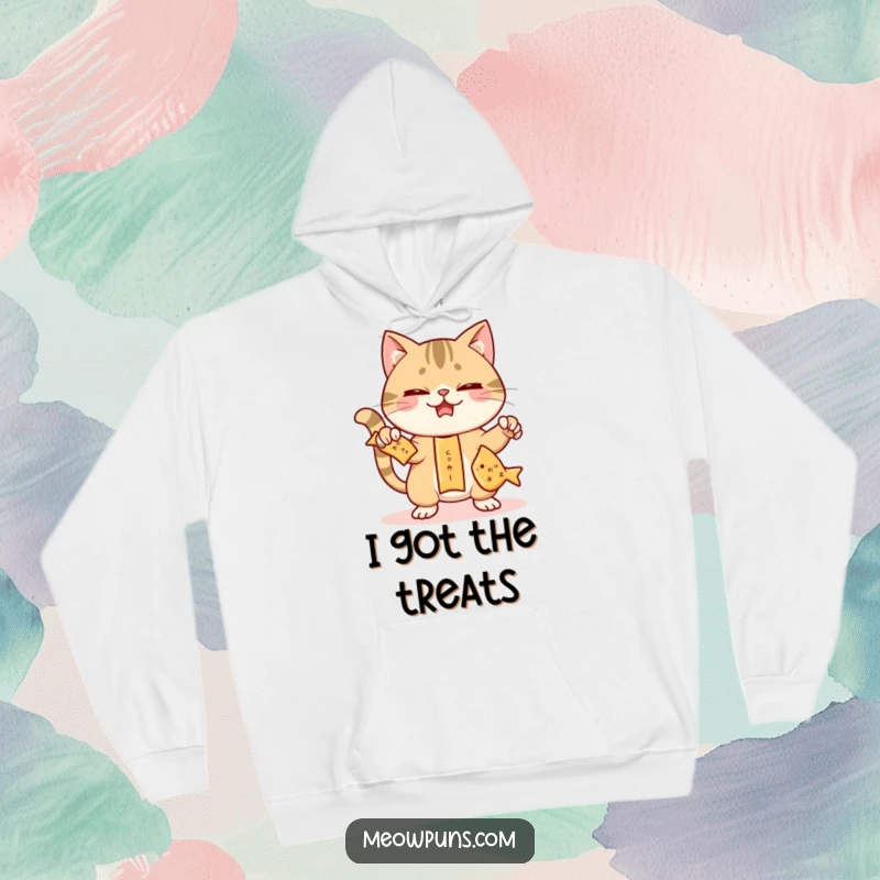 Funny cat hoodie showing a mischievous cat juggling three fish-shaped crackers, embodying playful skill and snack-time amusement.