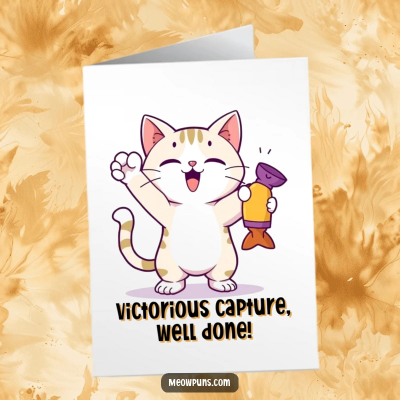 Funny Free Printable Congratulations Card: A cat in a superhero-like stance, holding a toy, celebrating a hard-earned victory with pride.