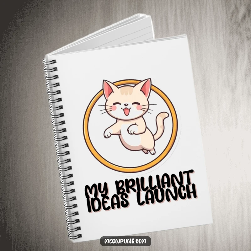 Funny cat notebook showcasing a cat leaping through a stylized M hoop, inspiring creativity and organization with a humorous touch.