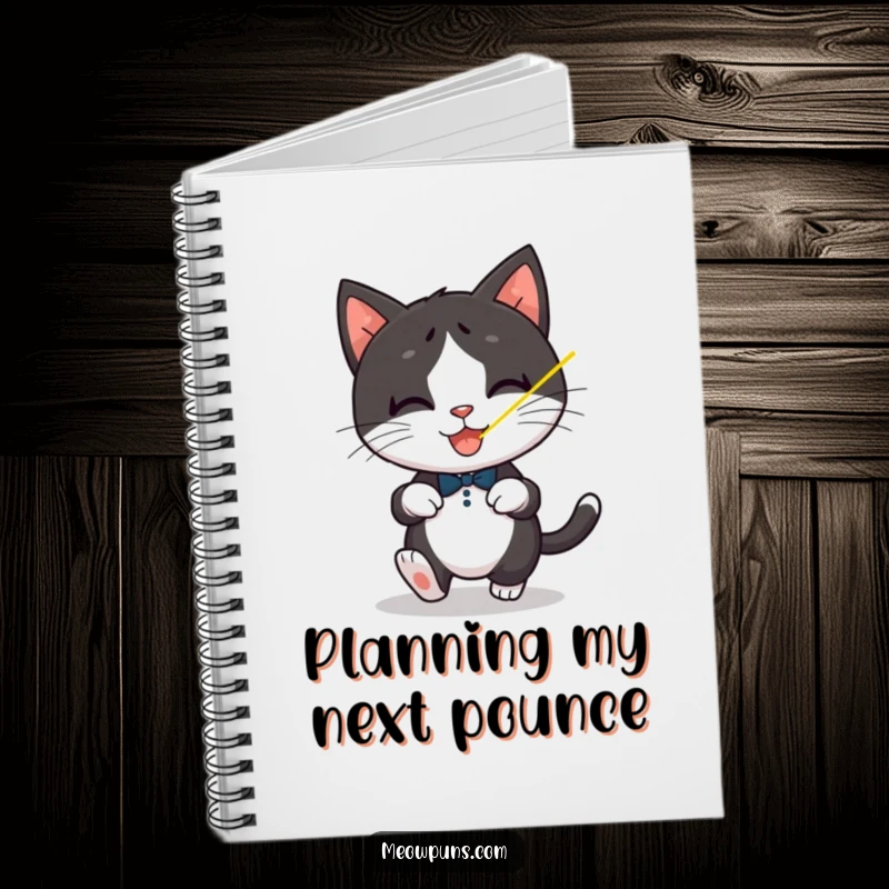 Funny Tuxedo Cat Notebook, a playful tuxedo cat chases a laser dot, for jotting energetic ideas.