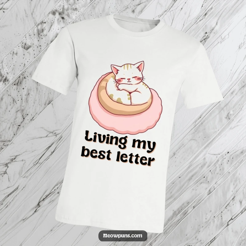 Funny cat t-shirt featuring a relaxed cat napping peacefully on a giant, soft letter, embodying pure comfort.