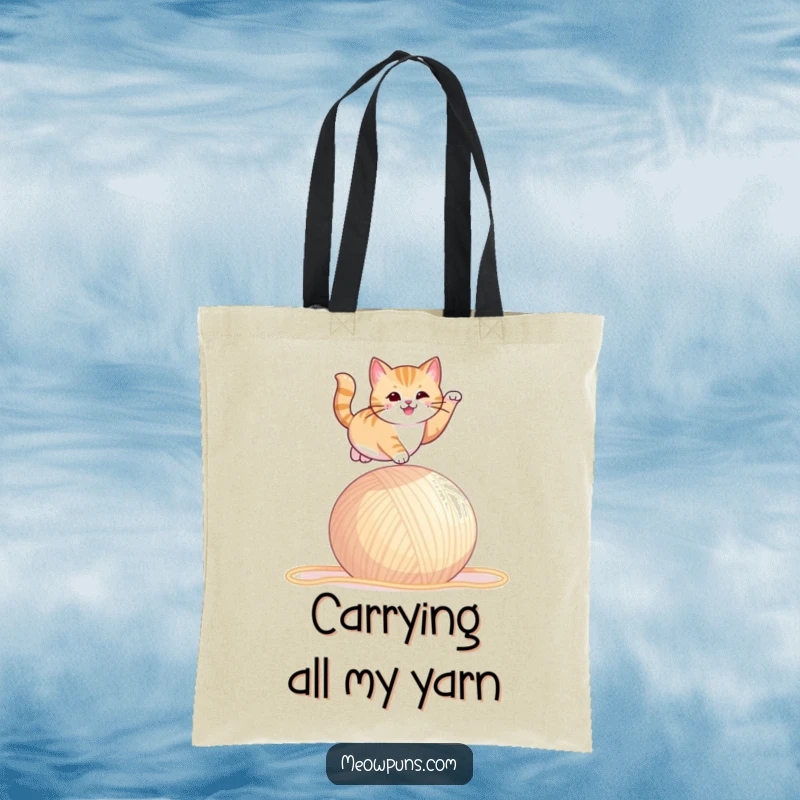 Funny tote bag illustrating a cat in a dramatic leap over a giant ball of yarn, full of energy.