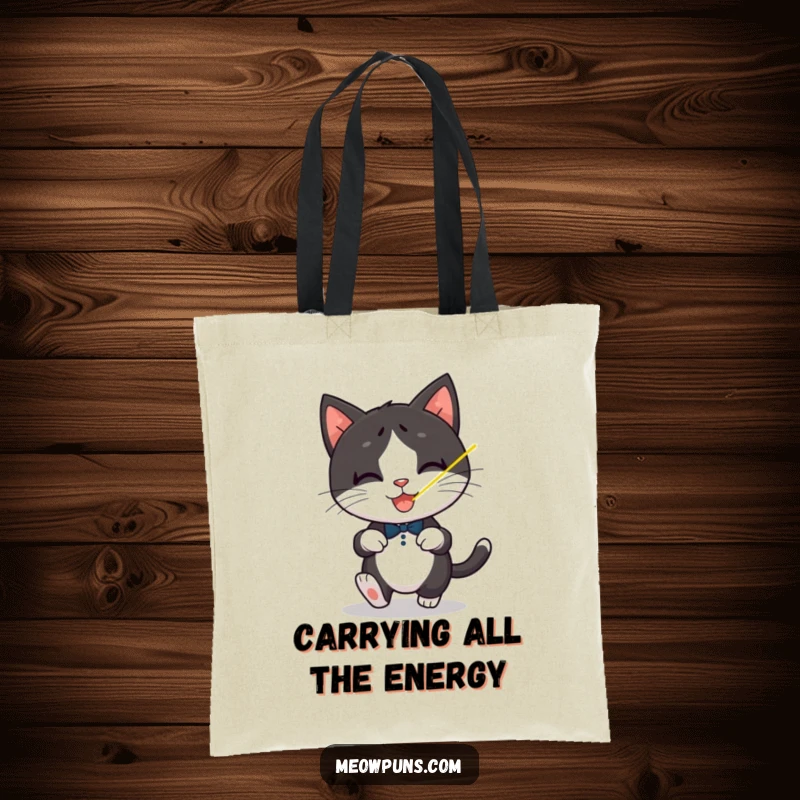 Funny Tuxedo Cat Tote Bag, a playful tuxedo cat chases a laser dot, carrying playful feline humor.