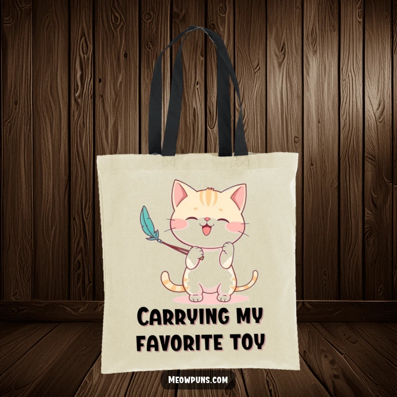 Funny tote bag featuring a cute cat character enthusiastically playing with a feather wand, perfect for carrying daily essentials.