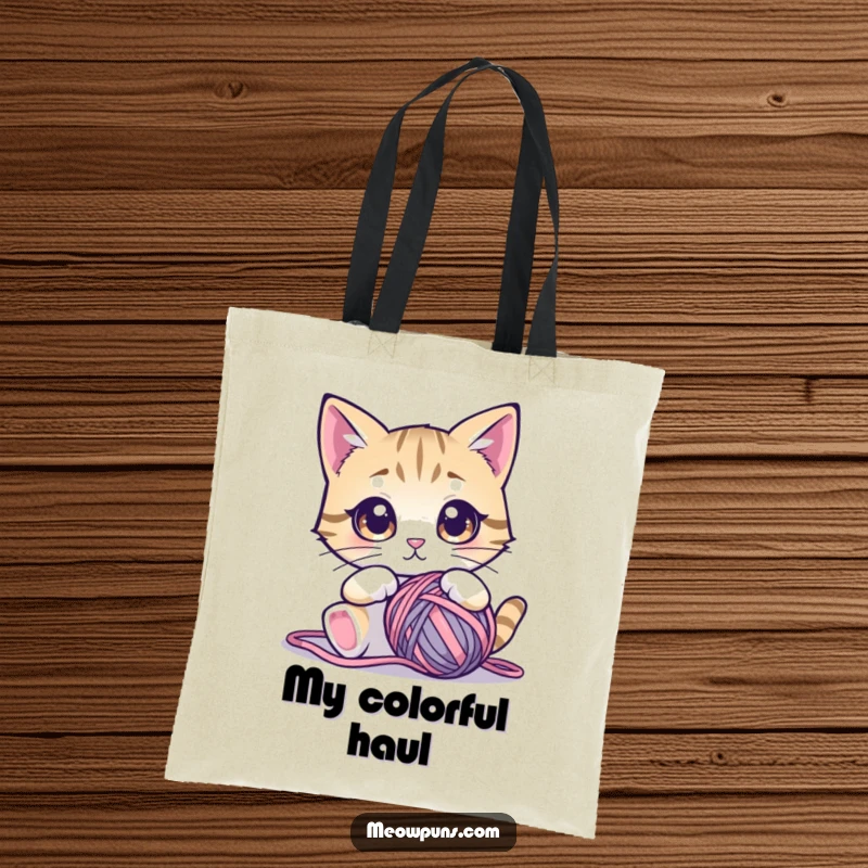 Funny cat tote bag showing a cute cat with large, mesmerized eyes focused on a ball of yarn, perfect for errands.